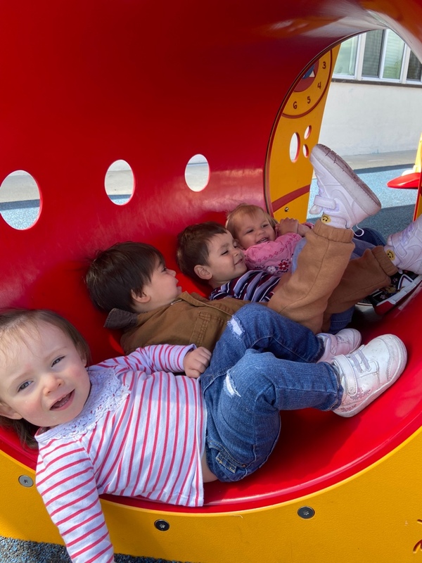 Toddlers playing in tunnel